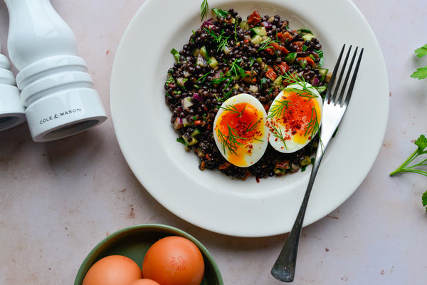 Herby beluga lentil salad with boiled eggs