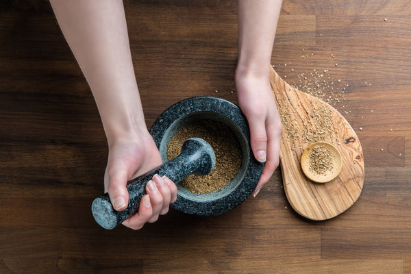 grey granite pestle and mortar with spices