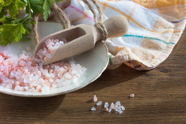 Chinen Salt on a plate with a wooden spoon