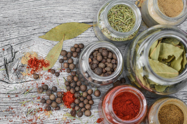 spices in glass jars on a table