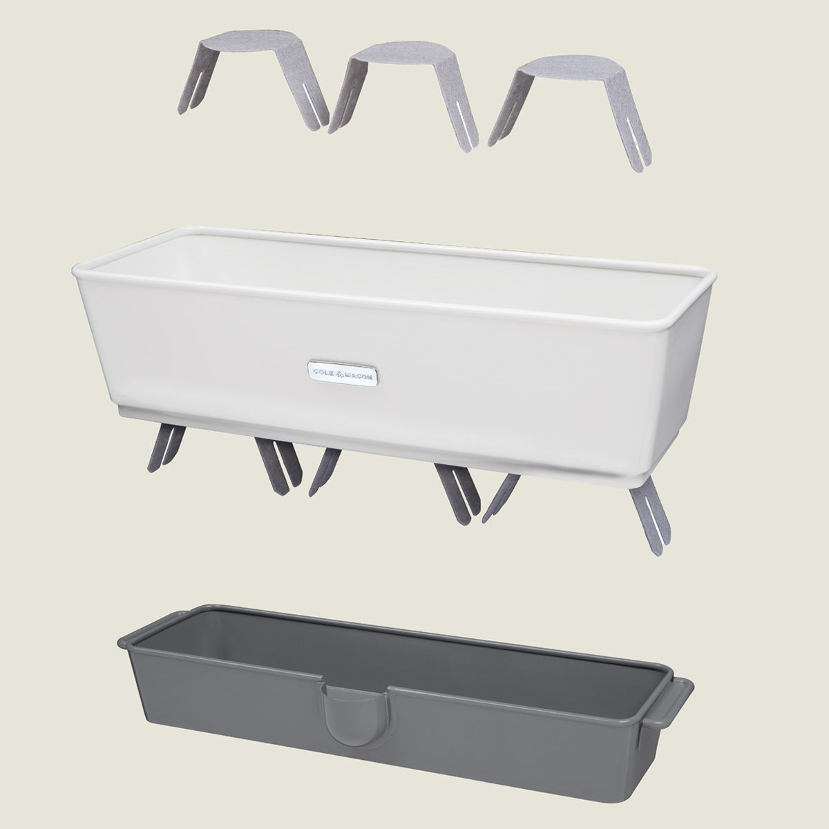 A white rectangular planter with gray detachable legs and a dark gray drip tray beneath it, all shown against a light background. The components are displayed separately in an exploded view.