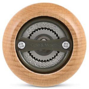 Close-up view of the bottom of the Cole & Mason King Pepper Baseball Bat Pepper Mill 710mm, highlighting its stainless steel grinding mechanism engraved with Cole & Mason and Stainless Steel.