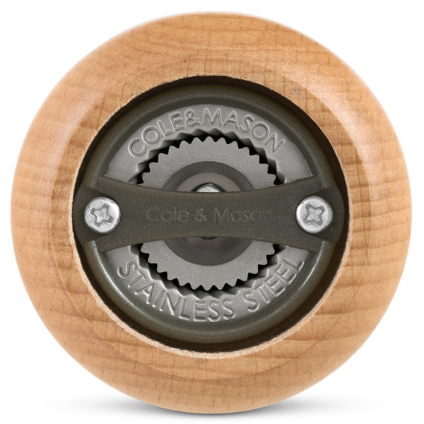 Close-up view of the bottom of the Cole & Mason King Pepper Baseball Bat Pepper Mill 710mm, highlighting its stainless steel grinding mechanism engraved with Cole & Mason and Stainless Steel.