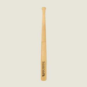 A 710mm King Pepper Baseball Bat Pepper Mill by Cole & Mason UK stands upright on an off-white background, its light natural finish features a Tiny Peppy logo near the bottom and a design inspired by the classic King Pepper mill.