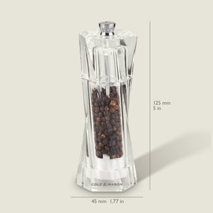 A clear Cole & Mason Aldeburgh Salt & Pepper Mill Set, filled with black peppercorns, features premium adjustable grinding mechanisms. The mill stands 125 mm tall and 45 mm wide on a light background with labeled dimensions.