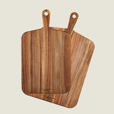 Two Cole & Mason Barkway boards overlap on a light background. Both feature natural acacia wood grain, rounded edges, and handles—an essential 2-piece bundle for any kitchen.
