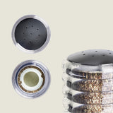 A close-up of the Cole & Mason Beehive Shakers Set, featuring transparent acrylic and black tops—shown from multiple angles to display the metal grinder and peppercorns inside—part of our salt and pepper dispensers collection.