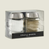 Upgrade your kitchen with the Cole & Mason Bray Glass Shakers Set, featuring elegant glass shakers with stainless steel tops. Includes one salt and one pepper shaker, attractively packaged in a clear box marked Cole & Mason.
