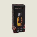 The Cole & Mason Bristol Duo Oil & Vinegar Pourer features a dual-chamber glass design for mess-free dispensing and comes in black and gold packaging with decorative leaf graphics.