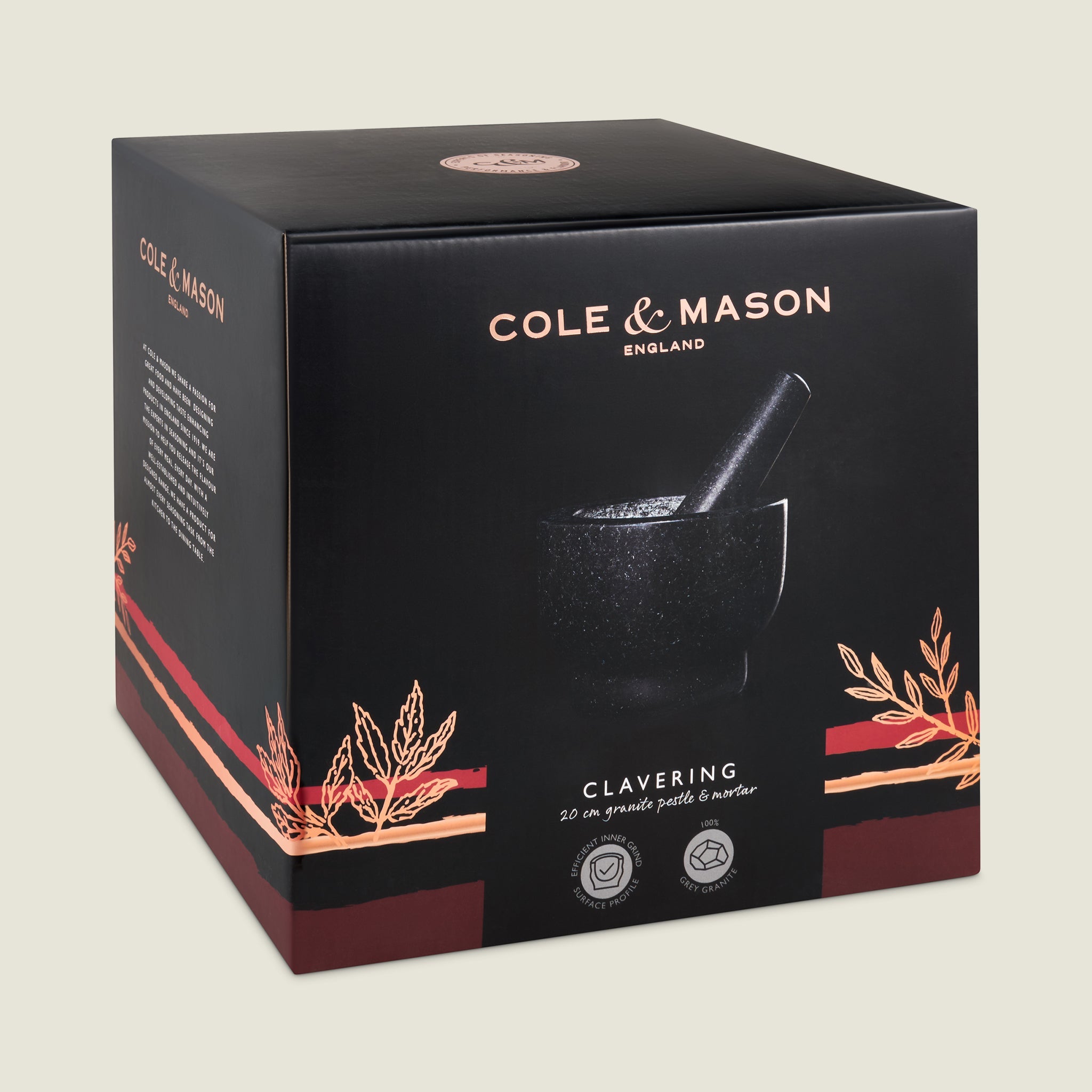 A black box with Cole & Mason branding displays the Clavering Pestle & Mortar, a 20 cm granite kitchen tool perfect for home chefs. Decorative wheat graphics and product details appear on the front.