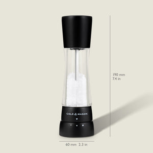 #salt The Cole & Mason Derwent Matt Black Salt & Pepper Mill features a clear acrylic body with a black top, filled with salt crystals. It stands upright, measuring 190 mm (7.4 in) high and 60 mm (2.3 in) wide at the base.