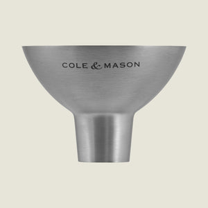 The Cole & Mason Dover Stainless Steel Funnel is an easy-to-clean kitchen essential, designed for effortless pouring and featuring signature Cole & Mason branding against a light, pale background.