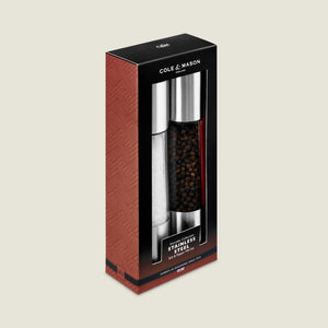 Cole & Mason Everyday Stainless Steel Salt & Pepper Mill Set in black and red packaging with white text comes in a rectangular box with a transparent window, showing the ergonomic, filled grinders with adjustable coarseness.