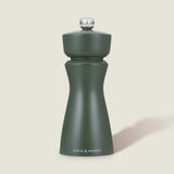 The Cole & Mason Kenton Rosemary Salt & Pepper Mill in matte sage green with a silver top and ceramic mechanism stands upright against a light off-white background.