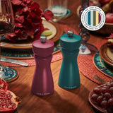 Two vibrant Cole & Mason Kenton Salt & Pepper Mills in Sea Salt, with ceramic mechanisms, sit on a wooden table set for dinner—perfect for a modern kitchen. A Mix and Match badge is visible in the top right corner.