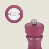 A close-up of the Kenton Sichuan Pepper Red Salt & Pepper Mill by Cole & Mason, featuring an interchangeable knob marked P and a durable ceramic grinding mechanism—perfect as a Sichuan pepper mill.