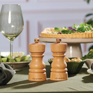 #130mm
Cole & Mason London beech mill set on a green-themed dining table