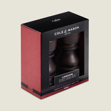 The Cole & Mason London Chocolate Wood Salt Shaker & Pepper Mill Set features premium grinding mechanisms and natural wood, presented in elegant black and red packaging with a clear display window.