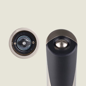 Close-up of the Cole & Mason Richmond Electronic Salt & Pepper Mill Set in black and metallic finish, highlighting the adjustable grind mechanism and top button, set against a light background.