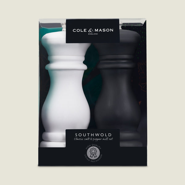 The Cole & Mason Southwold Capstan Salt & Pepper Mill boxed set includes one white and one black mill, both with adjustable grinding and durable build, packaged with clear brand name and product details.
